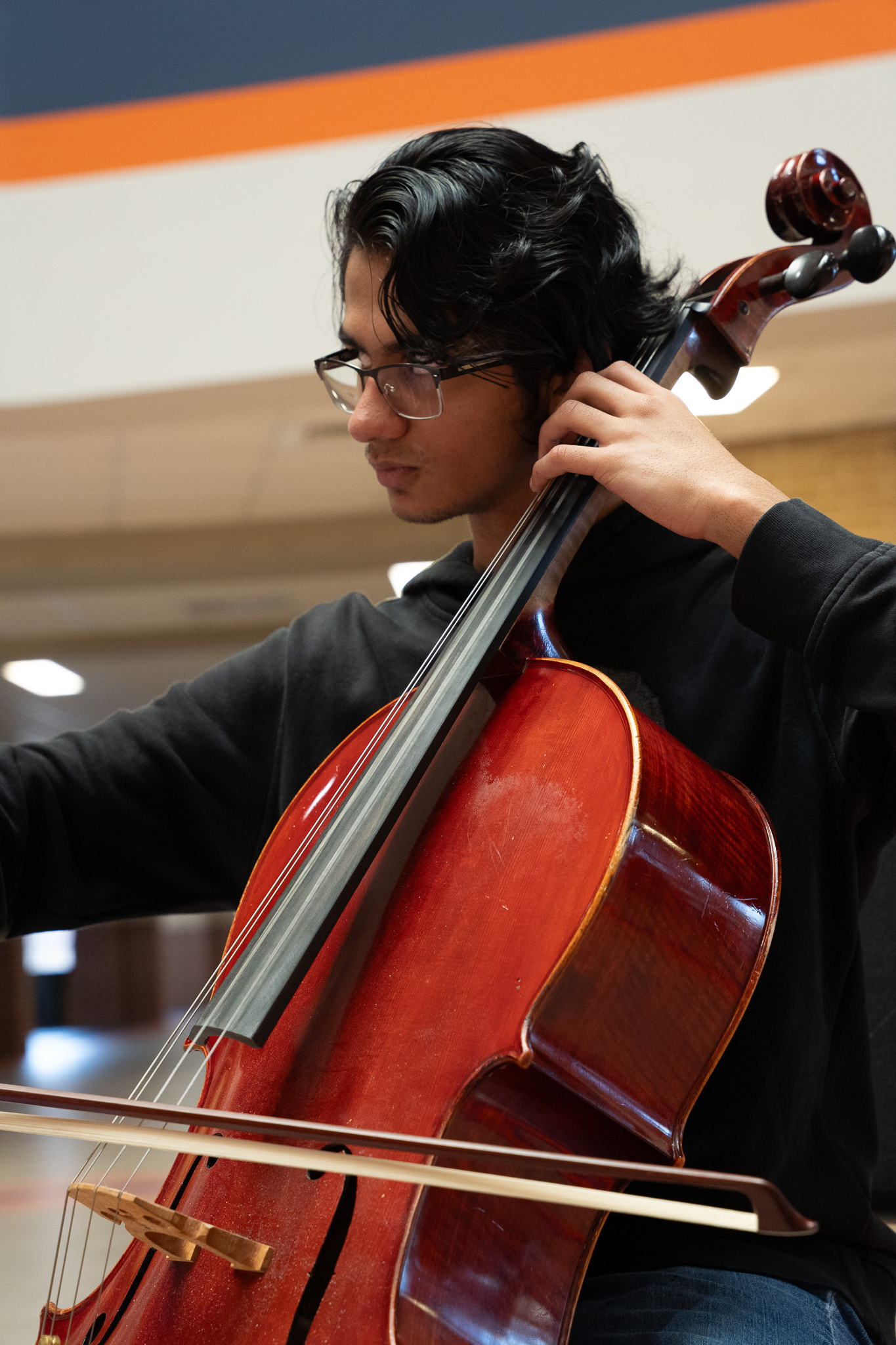 Nikhil Murali playing cello